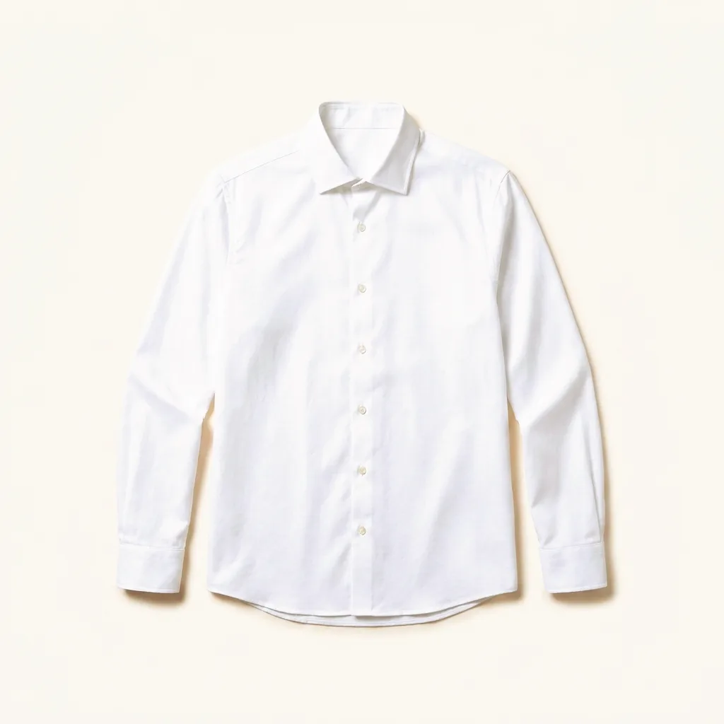 A white cotton shirt, photographed flat on cream.